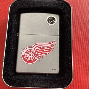 Red Wings Zippo Lighter. New with tags& paper work.